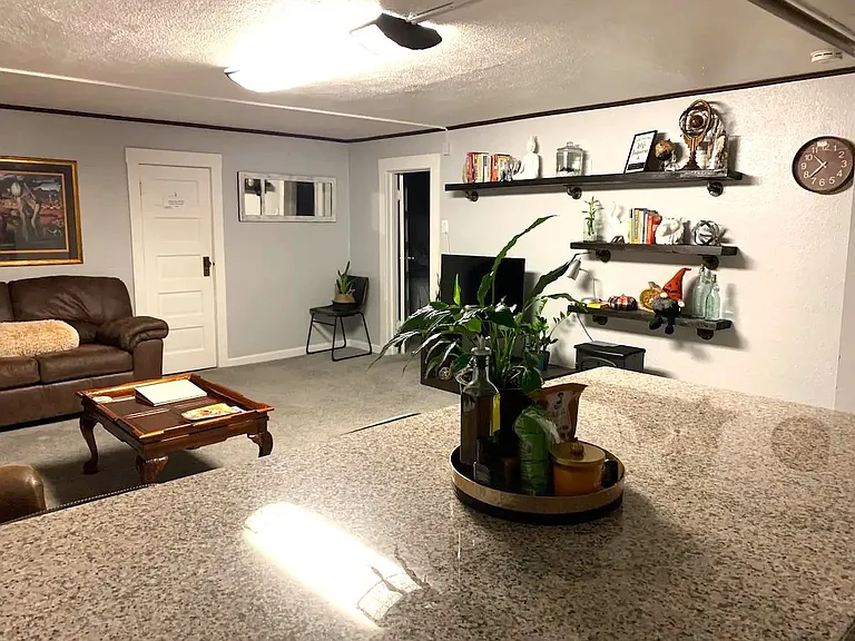 Living space downstairs, mudroom behind the door.