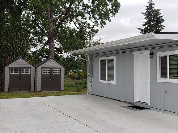 Entry to Unit B with view of sheds