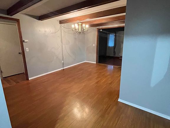 Dining Room -Hallway on Left - Kitchen On Right - Step Down to Second Living Room