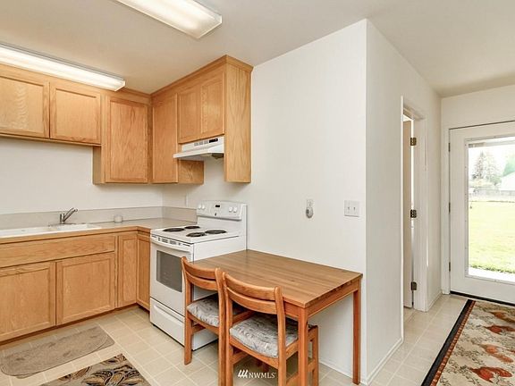 Additional picture of the kitchen area, to your right is the entrance doorway from the inside view.