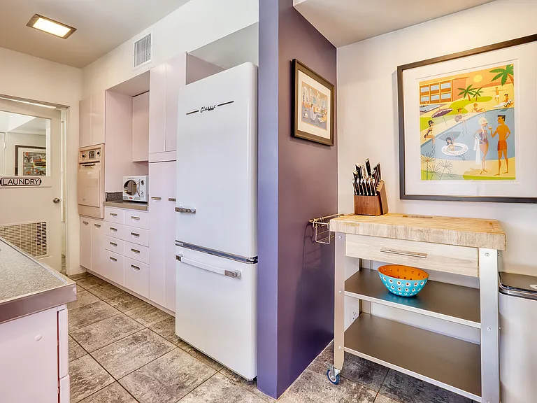 New fridge, electric stove and oven, microwave and dishwasher in retro style.