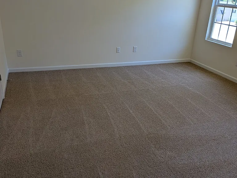 Relax in the spacious owner's suite complete with a walk-in closet and private bath designed for comfort and convenience.