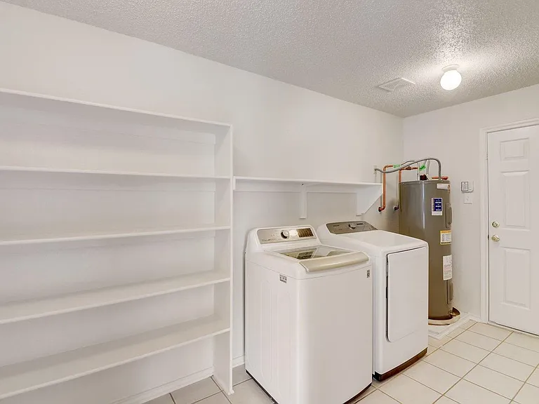 Laundry with Washer Dryer included and additional shelving