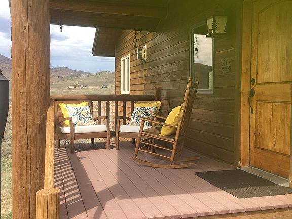 Porch with view of lake and mountains