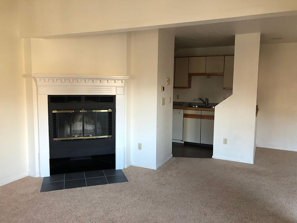 Living room with kitchen in background