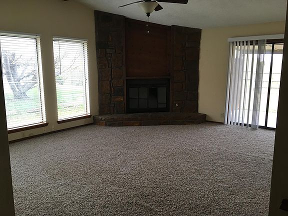 Living with lots of windows and wb fireplace 