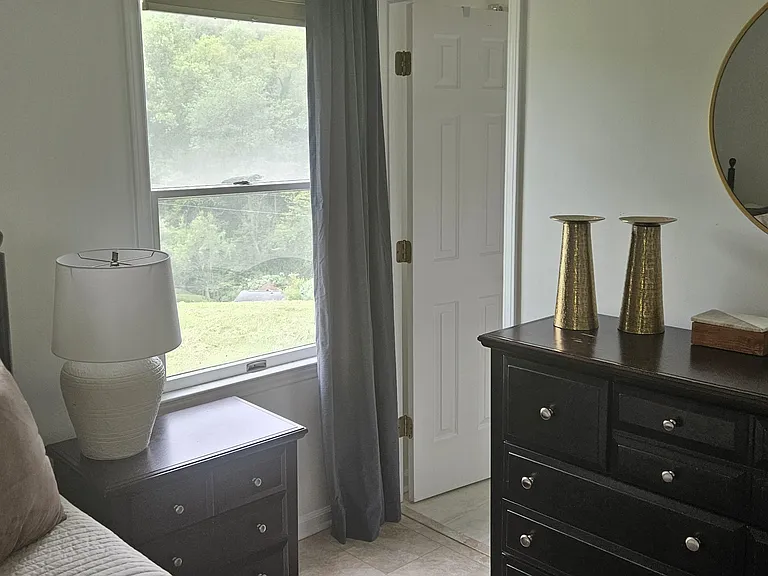 View inside bedroom, toward bathroom entrance