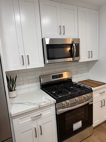Stunning, updated kitchen equipped with brand-new KitchenAid appliances.