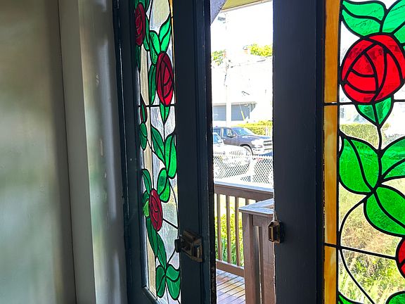 Front entry door with original stained glass panels.