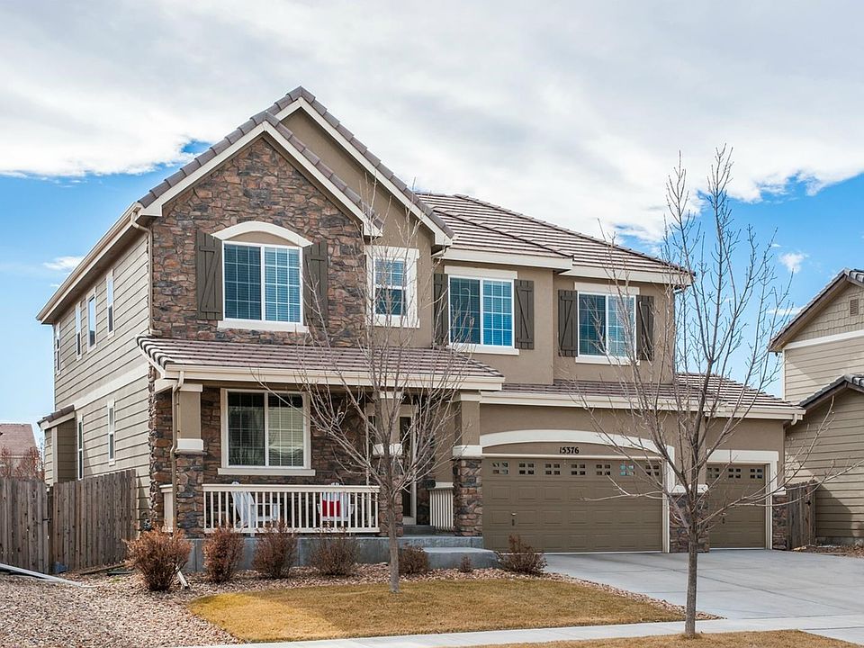 Gorgeous upgraded elevation with two-story stone and a concrete
