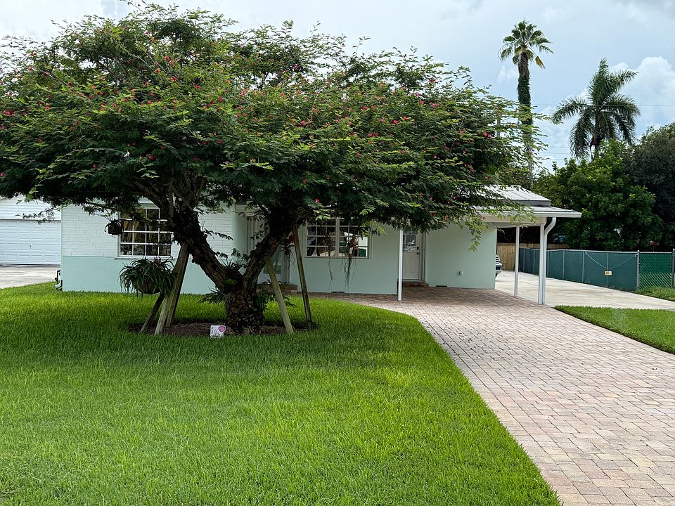 Front of House with carport