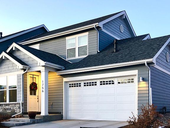Generous sized two car garage that is insulated and has a mud room in the garage and inside the house.