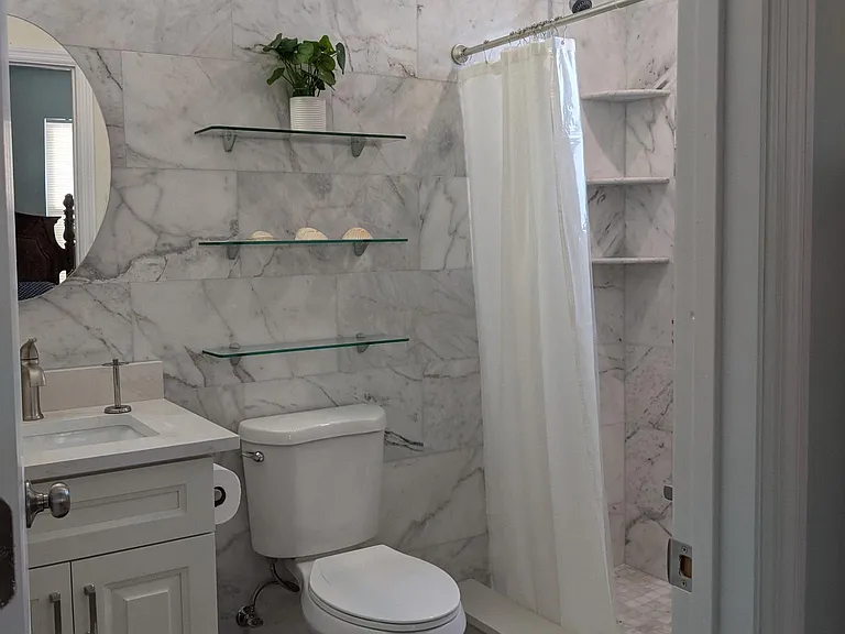 Master Bathroom with White Marble Shower.