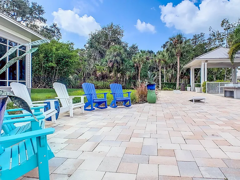Watch or join in the excitement at the open-air game area boasting a ping pong table and cornhole boards. Whether playing or relaxing, the riverside ambiance enhances every moment of outdoor amusement.