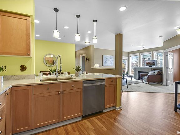 Large kitchen with lots of counter space, cabinets and quartz counters.