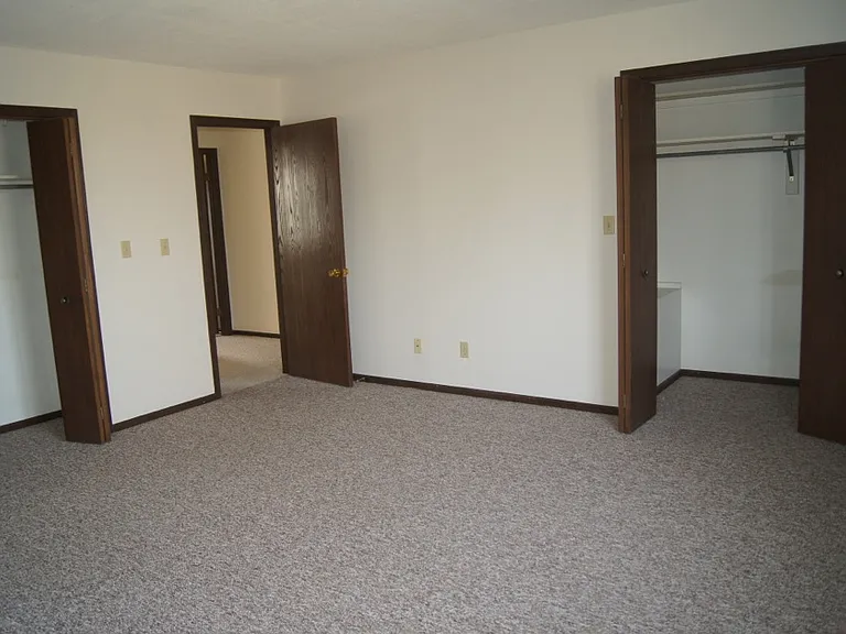 Oversized 2nd floor bedroom with two clothes closets. Vision thru door is bathroom door.