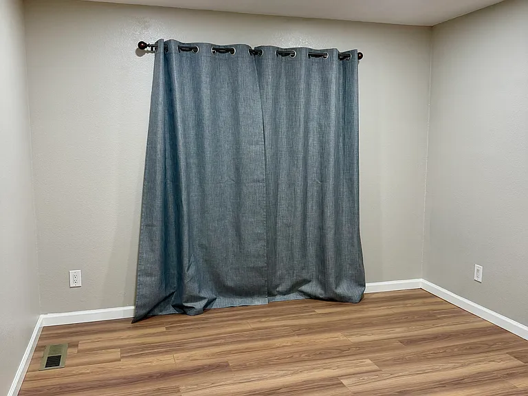 Master bedroom; door opens onto small balcony.