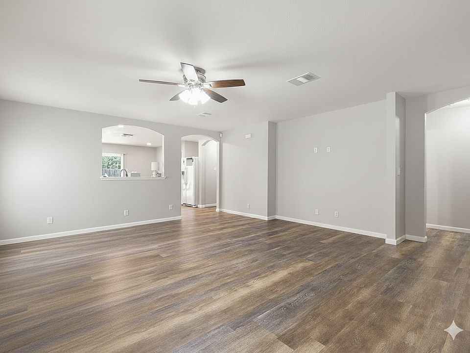 Large living room with beautiful wood-like luxury vinyl plank flooring