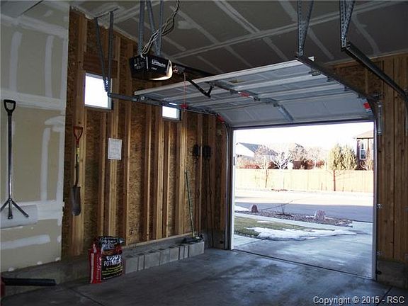 2 car garage has separate doors, windows for natural light and a