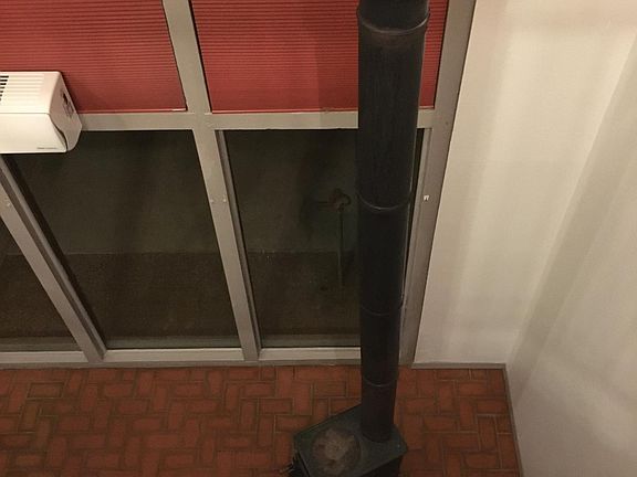 Living room wood stove view from bedroom