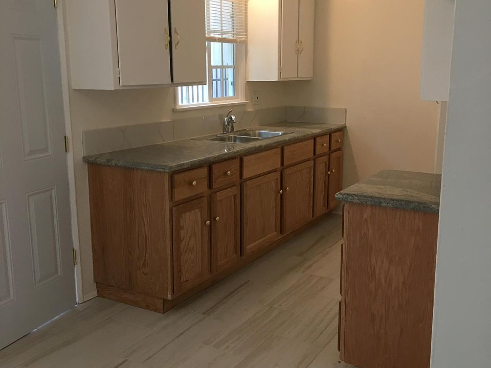 Kitchen and Dinning room. New flooring, new kitchen lower cabinets with granite tops, new paint, new lighting, new mini-blinds, new plumbing.