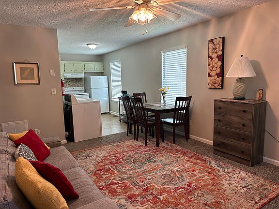 living room and kitchen in back