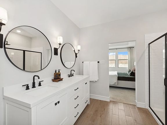 Primary bath with glass shower enclosure