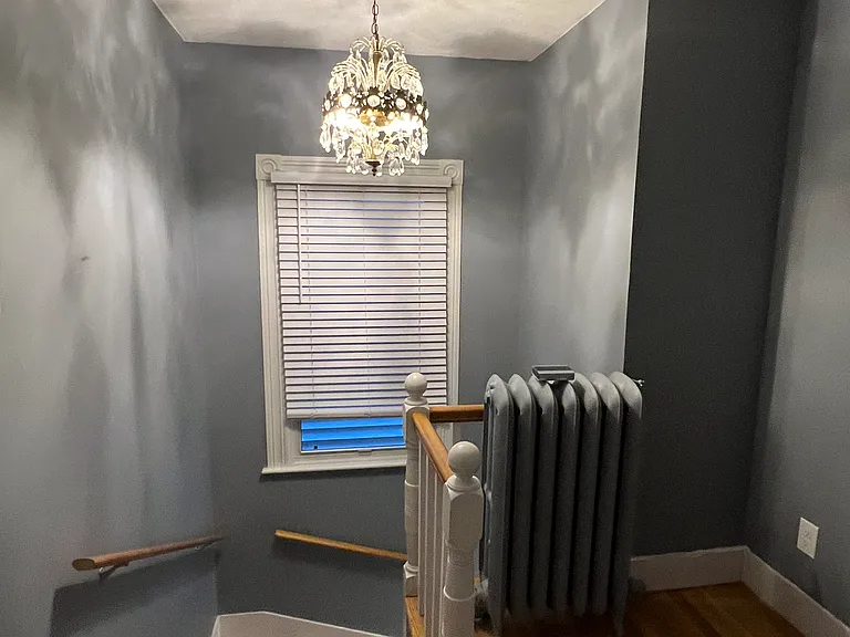 Foyer with original antique light fixture
