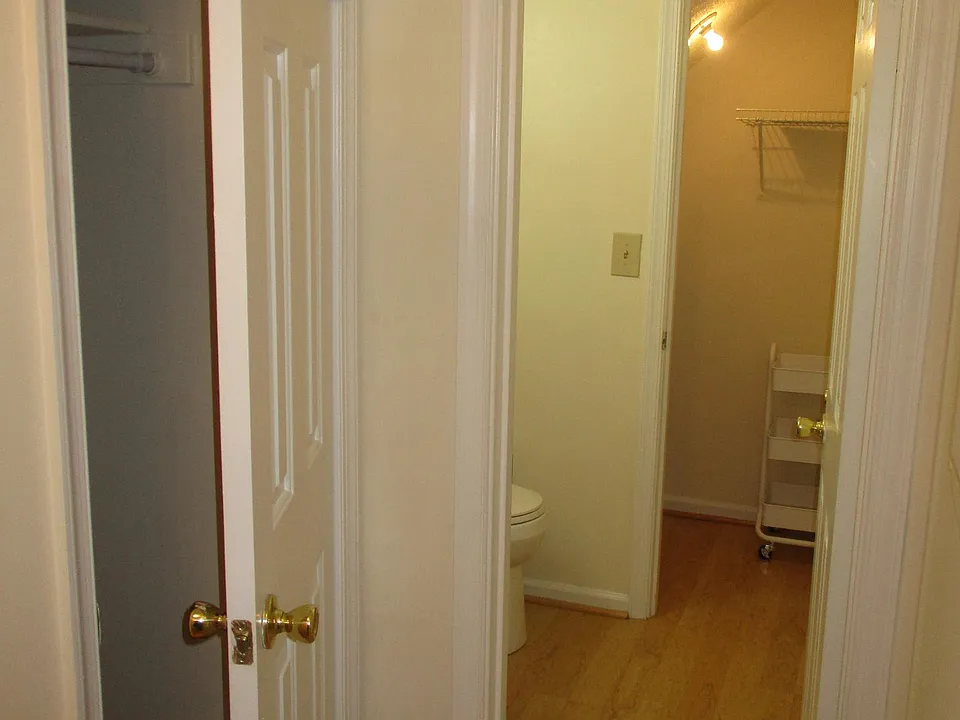 foyer coat closet, 1/2 bath with closet