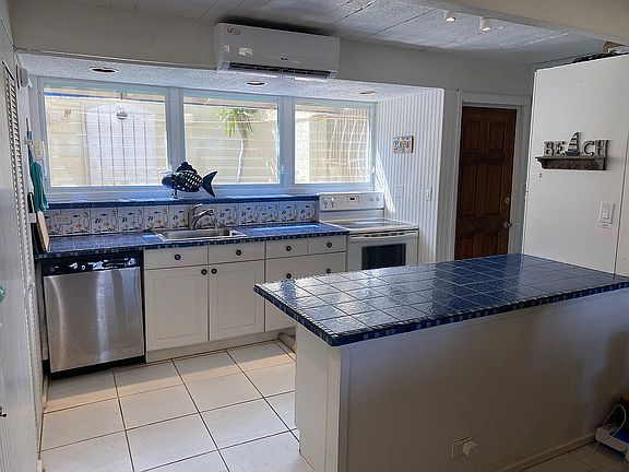 Cutely tiled kitchen