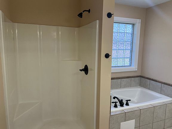 Shower and Soaking Tub in Primary Bathroom