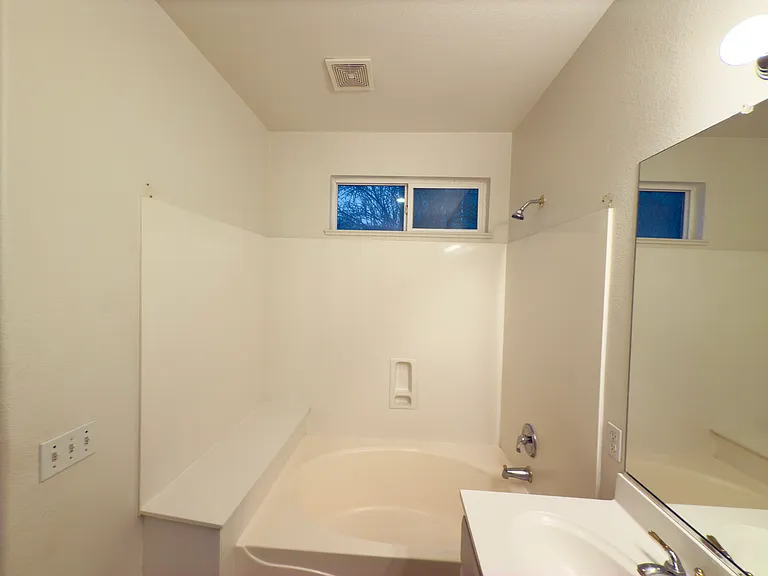 Luxurious master bathroom with dual sinks, a soaking tub, and ample space for relaxation and comfort!