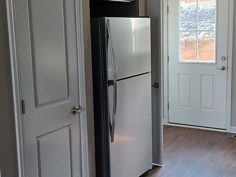 In kitchen, looking towards back door.