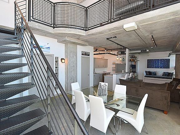 Great floor plan features open living, dining, kitchen, half bath & laundry on first floor. Polished cement floors throughout first floor. Upstairs is