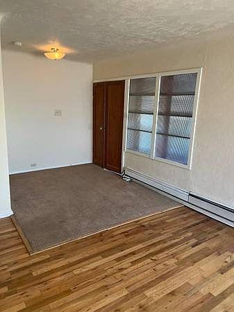 Opposite end of living area, double doors lead to bedroom