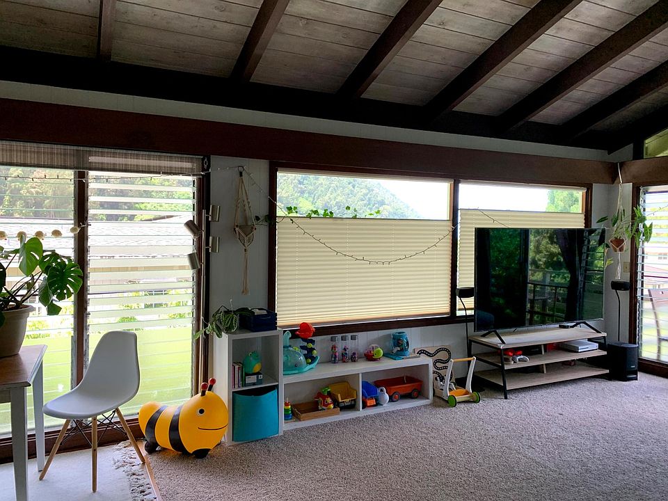 Living room - Picture windows with dual motion coverings. Ocean view on clear days.