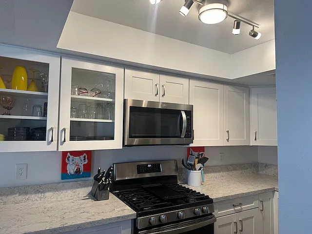 New Kitchen with granite countertops, new appliances, and new LED ceiling lights