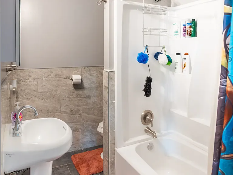 Bathroom with tub and stand up shower