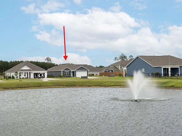 View to front of home from amenity pond