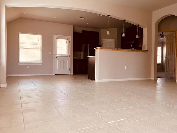 Tile floors throughout living, kitchen and all bathrooms.