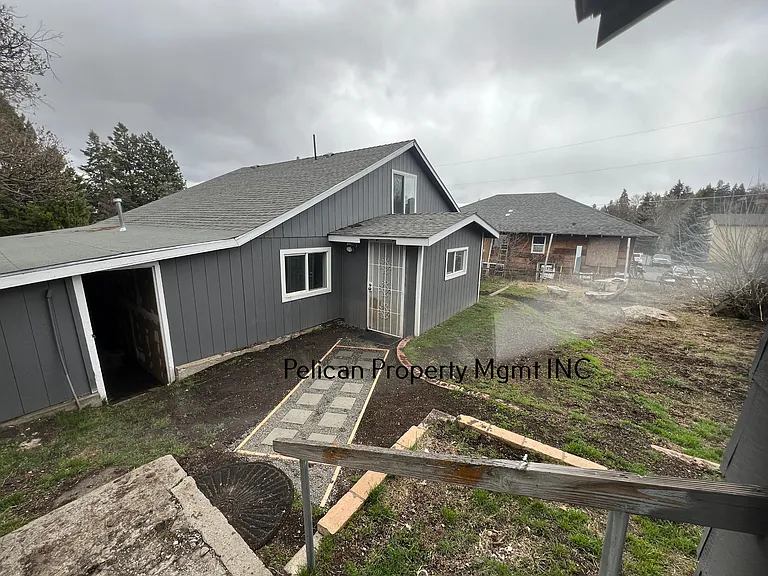 view from garage to back door entrance into laundry/mud room