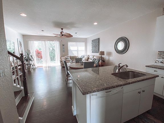 Kitchen to great room out to patio.