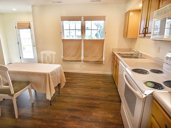 Sunny eat-in kitchen has southern exposure.