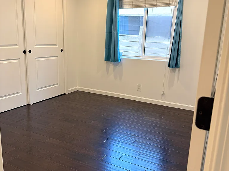 Bedroom 3 with dimmable recessed LED lighting.