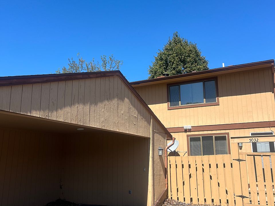 covered carport and private gated courtyard entry to unit