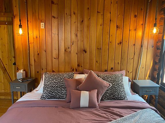 Primary bedroom with king bed and cozy bedding.