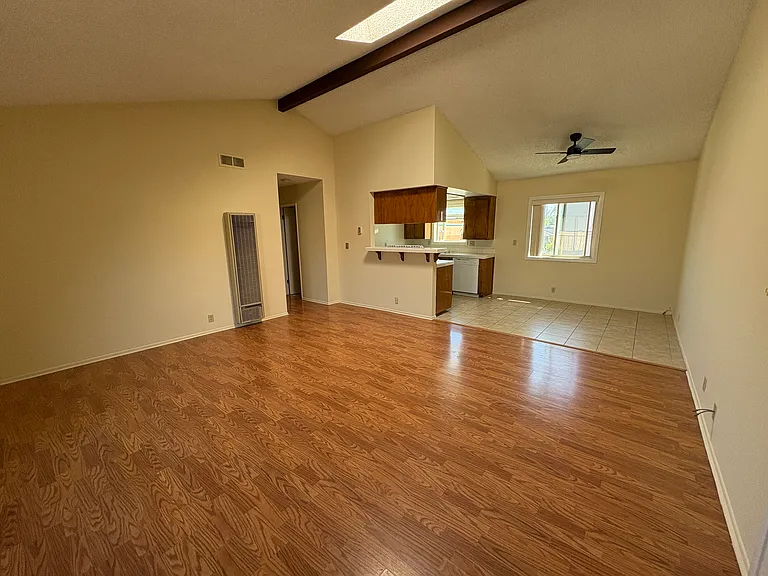 Living room with skylight and cathedral ceiling