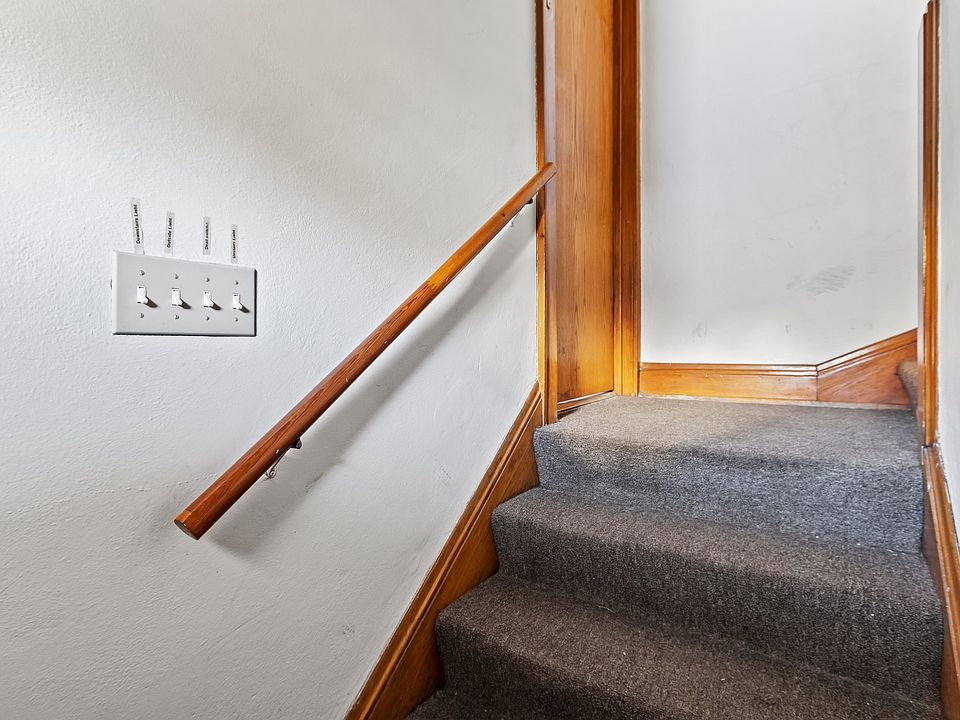Stairs leading up to upper unit from the back door entrance