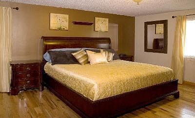 GLEAMING HARDWOODS IN MASTER BEDROOM