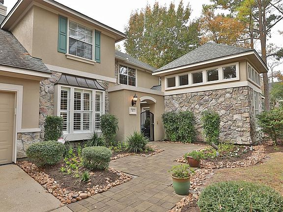 The natural slate entryway and walkway were professionally designed and installed. The stone accents are stunning for incredible curb appeal. The stone wall ahead is the Casita, which not only has an outside private entrance, but has also been redesi